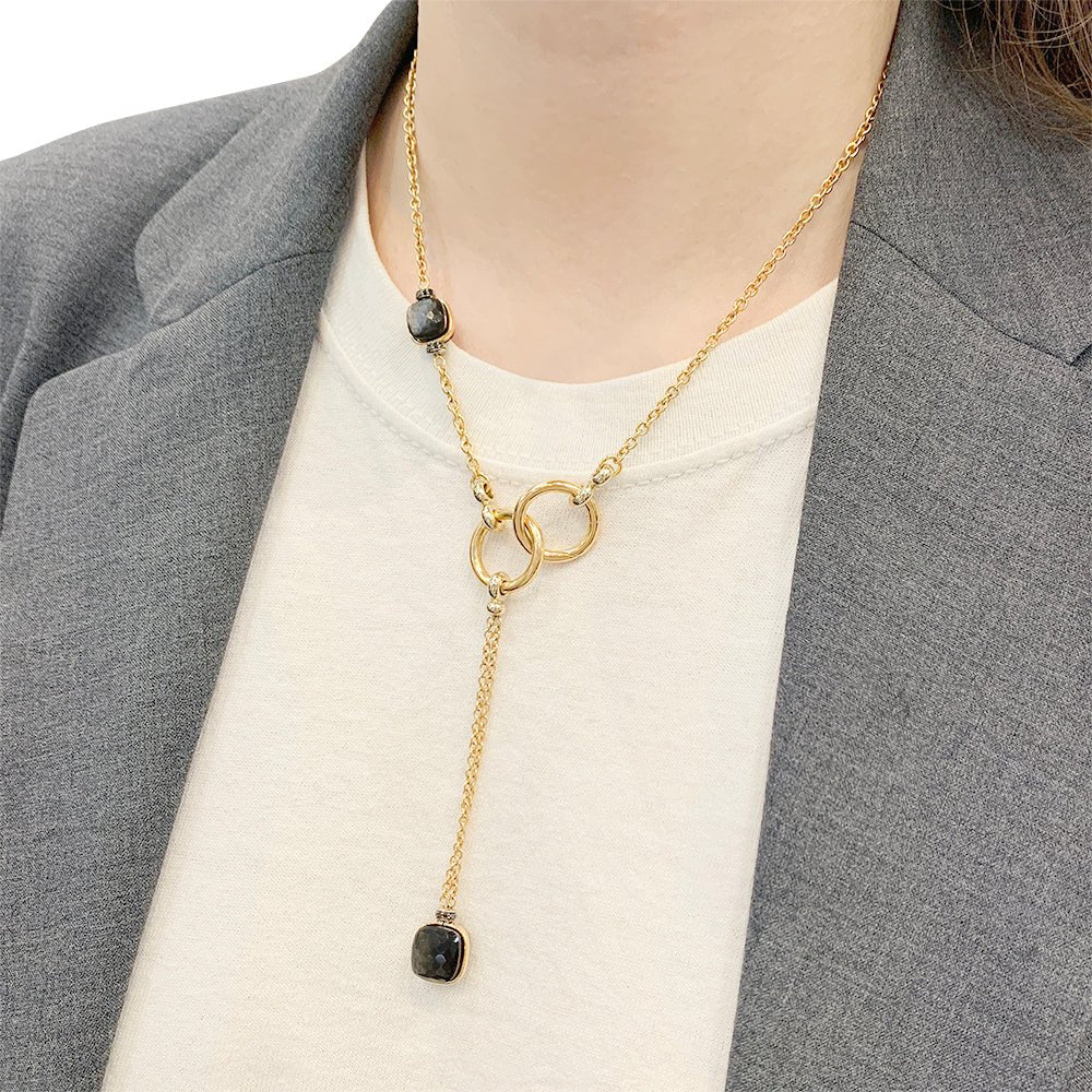 Collier Pomellato, "Nudo", or rose, obsidiennes, diamants noirs. - Castafiore