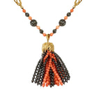 Collier sautoir CHAUMET "Pompon" en or jaune, corail et hématite - Castafiore