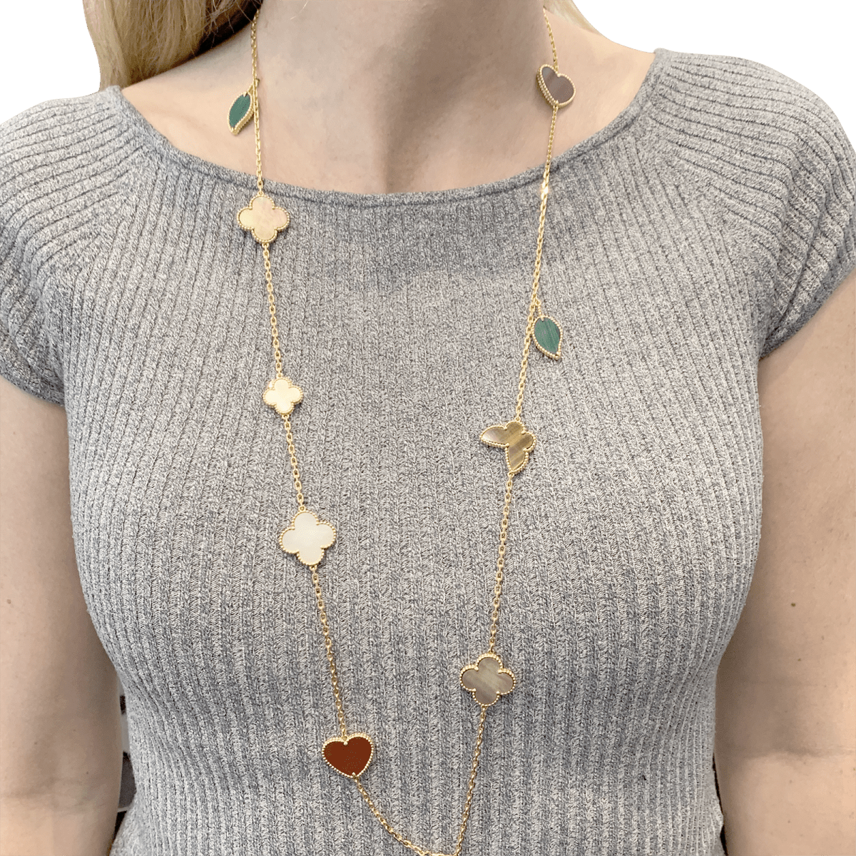 Collier - Sautoir VAN CLEEF & ARPELS "Lucky Alhambra", or jaune, cornaline, malachite, oeil de tigre, nacre - Castafiore