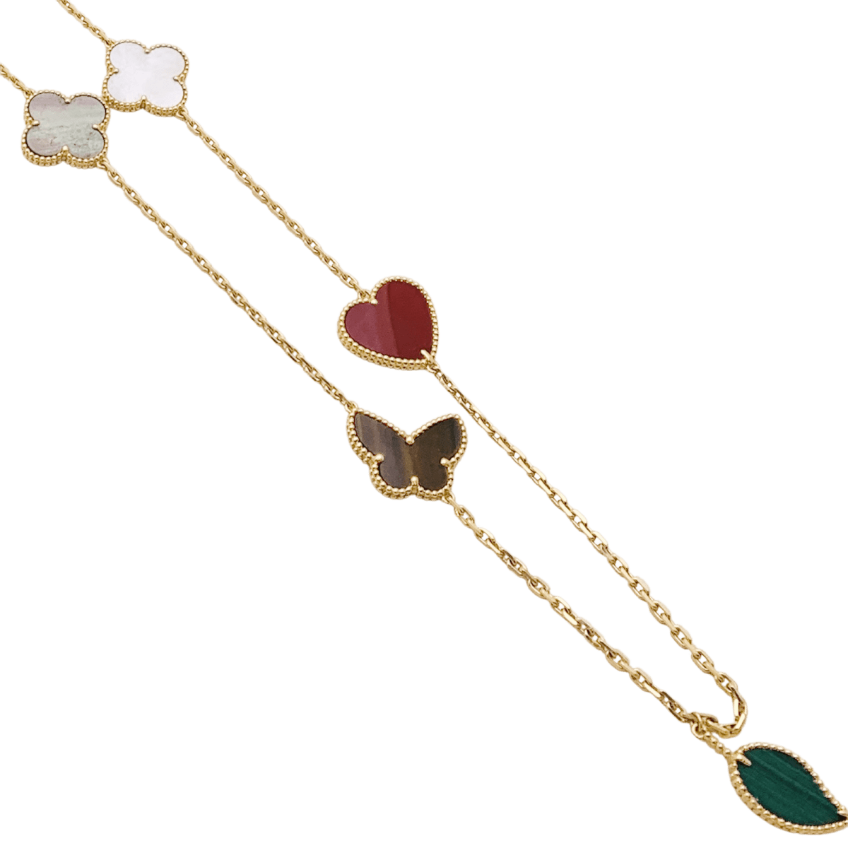 Collier - Sautoir VAN CLEEF & ARPELS "Lucky Alhambra", or jaune, cornaline, malachite, oeil de tigre, nacre - Castafiore