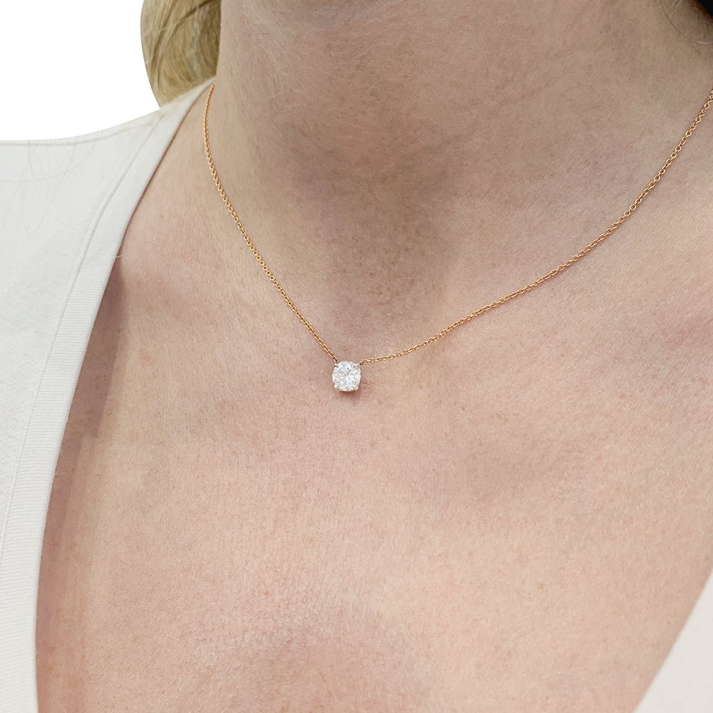 Collier solitaire deux ors, diamants. - Castafiore