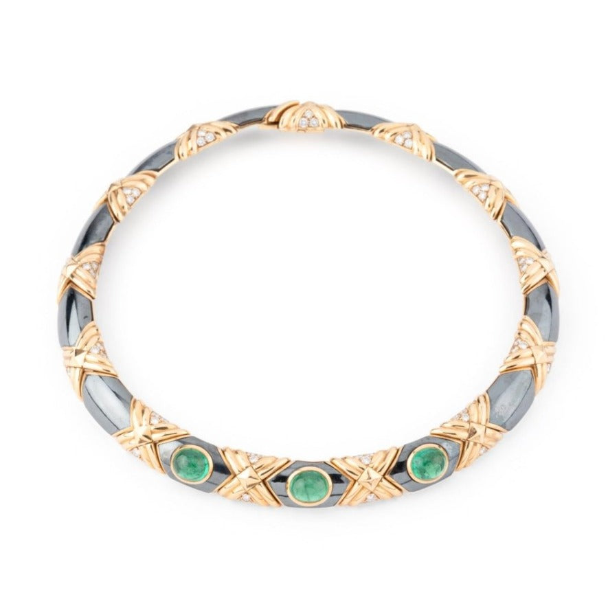 Collier torque BULGARI en or jaune, hématite et émeraudes - Castafiore