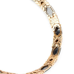 Collier torque BULGARI en or jaune, hématite et émeraudes - Castafiore