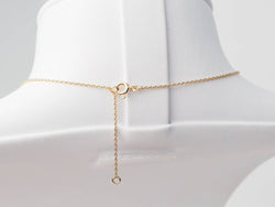 Collier volutes en or jaune et argent, grenat diamants et perle - Castafiore