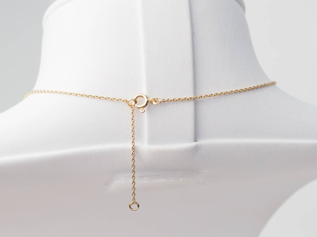 Collier volutes en or jaune et argent, grenat diamants et perle - Castafiore