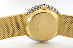 Montre CHOPARD, Réf. 810, or jaune 18 carats et diamants, bracelet intégré or massif, vers 1980.