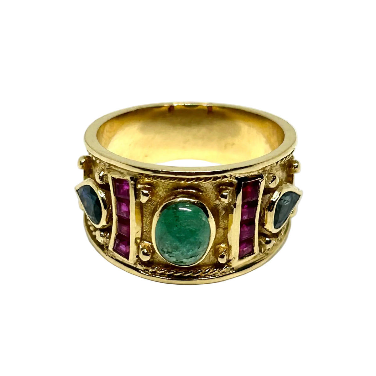 Bague Bandeau en or jaune, émeraude, rubis et saphirs