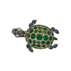 Broche GUBELIN en or jaune, émeraudes, saphirs et diamants