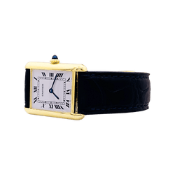 Montre Cartier, "Tank Louis Cartier", or jaune, bracelet cuir.
