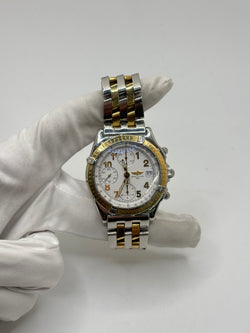 Montre Breitling Chronomat en or et acier