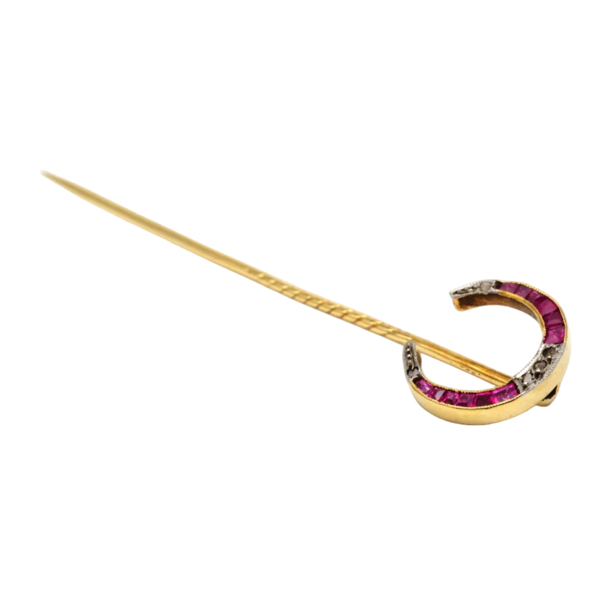 Broche en or jaune, rubis et diamants