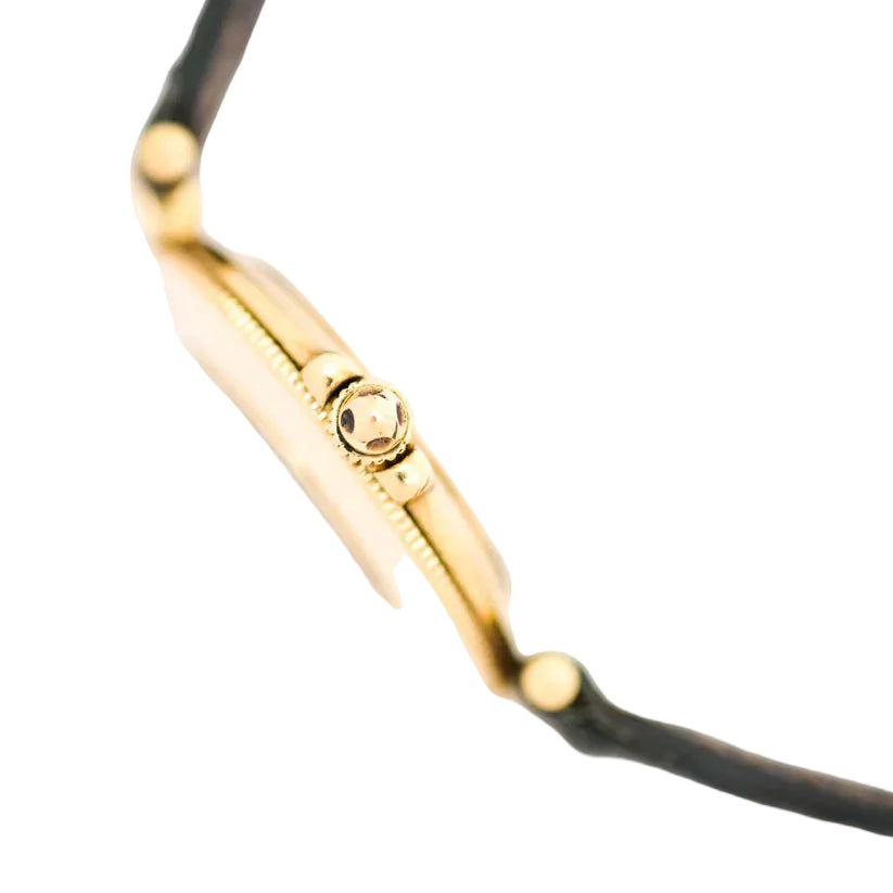 Montre JAEGER-LECOULTRE en or jaune, nacre, cuir, émeraudes et diamants