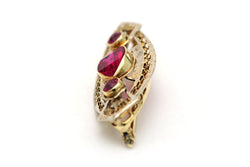 Broche Épingle en or jaune et rubis