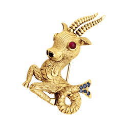 Broche-clip, "Capricorne", or jaune, rubis, saphirs.