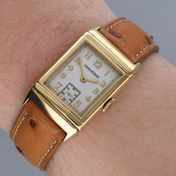 Montre JAEGER LECOULTRE "Reverso Vintage" en or blanc, or jaune et cuir