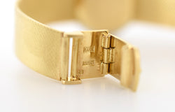 Montre CHOPARD, Réf. 810, or jaune 18 carats et diamants, bracelet intégré or massif, vers 1980.