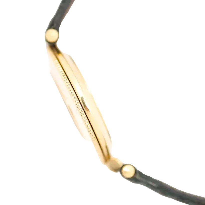 Montre JAEGER-LECOULTRE en or jaune, nacre, cuir, émeraudes et diamants