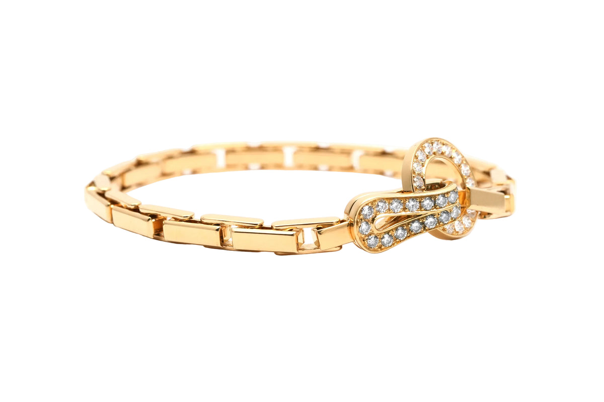 Bracelet Maille CARTIER "Agrafe" en or jaune et diamants
