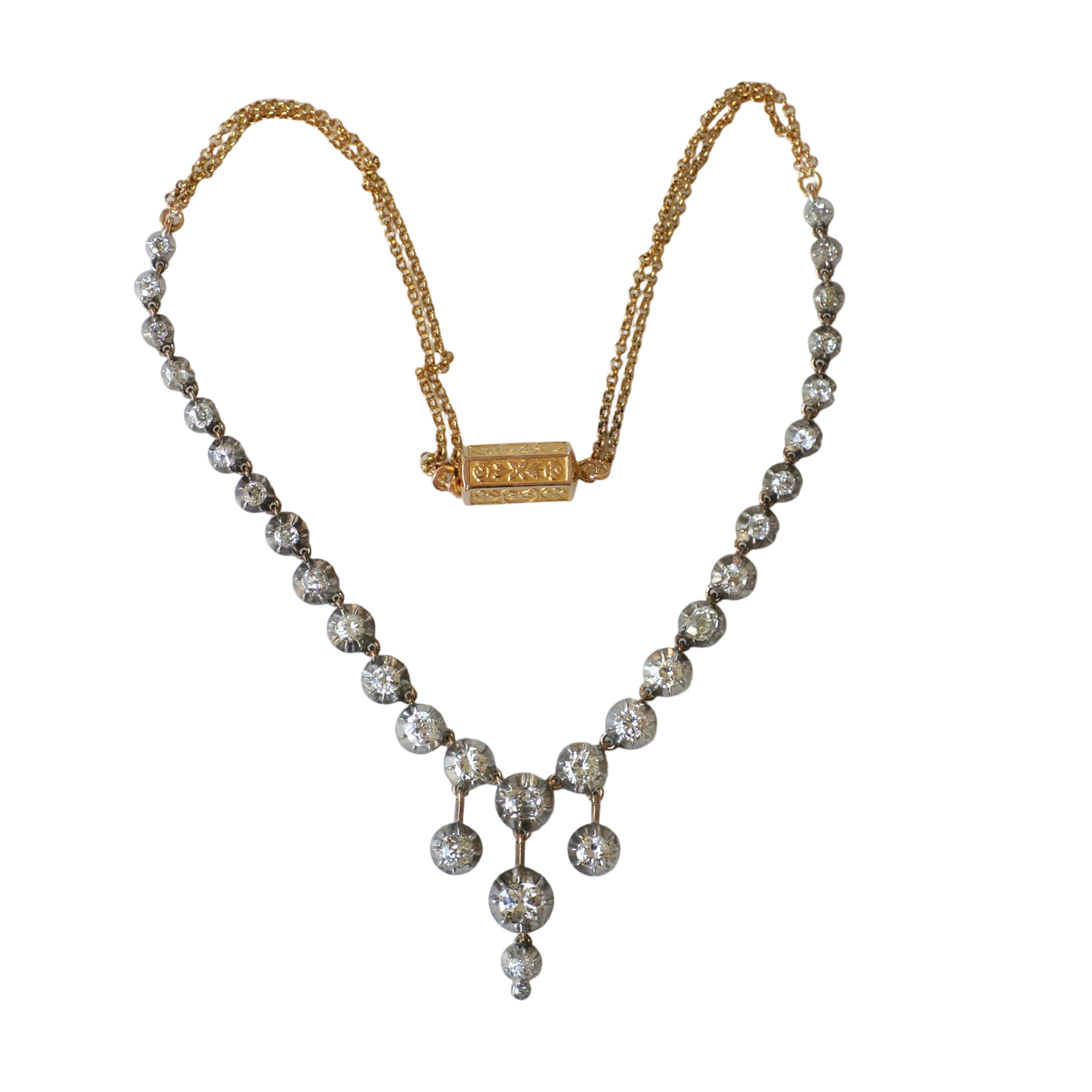 Collier Rivière en or jaune, or rose, argent et diamants