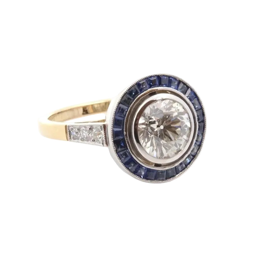 Bague Entourage en or jaune, platine, saphirs et diamants