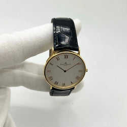 Montre BAUME & MERCIER "Classima" en or jaune, acier et cuir