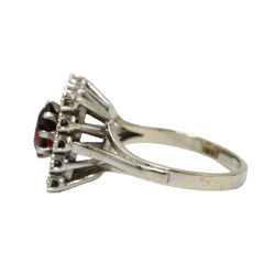 Bague Entourage en or blanc, grenat et diamants