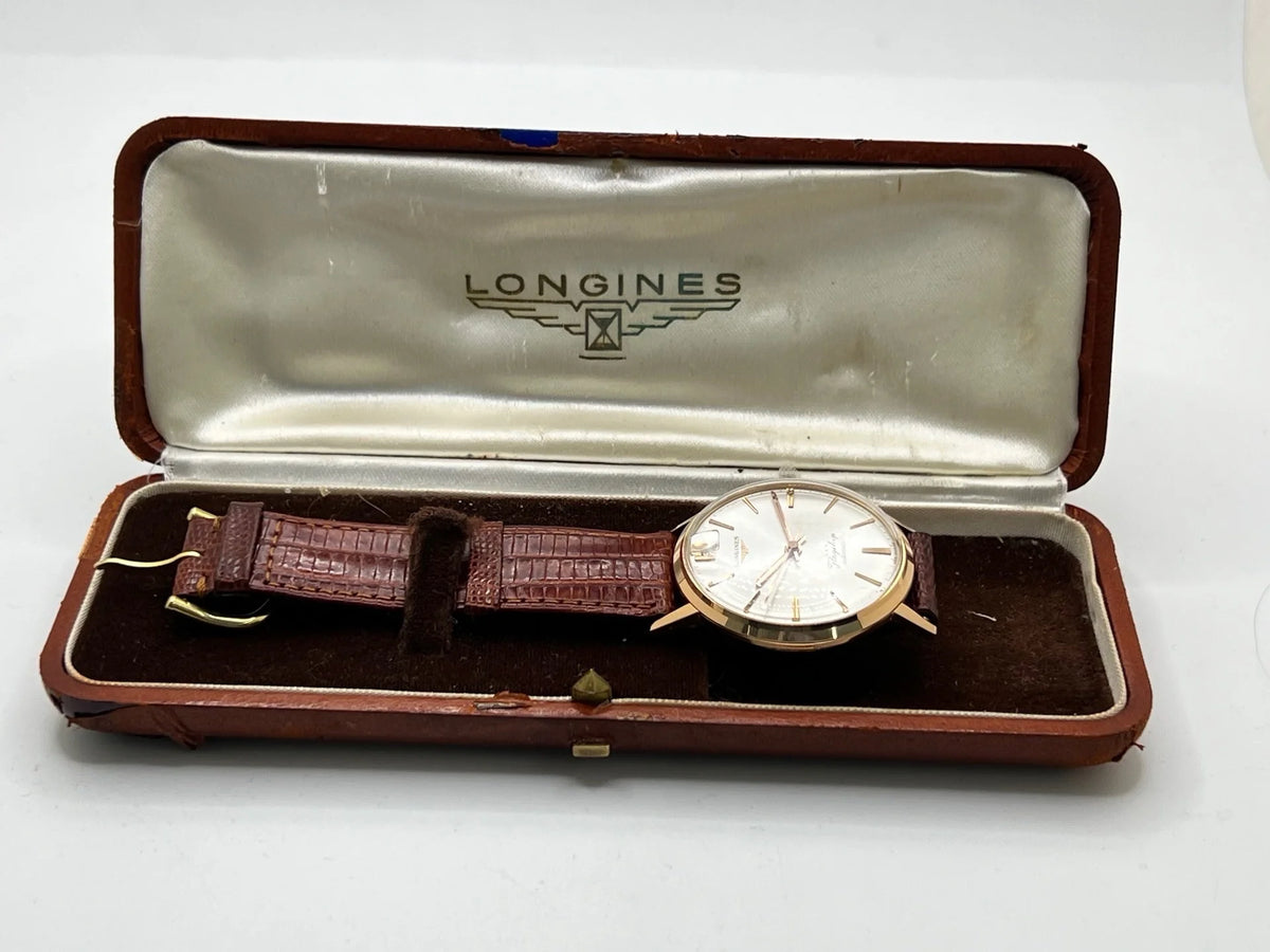 Montre LONGINES "Flagship" en or rose, acier et cuir