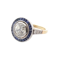 Bague Entourage en or jaune, platine, saphirs et diamants