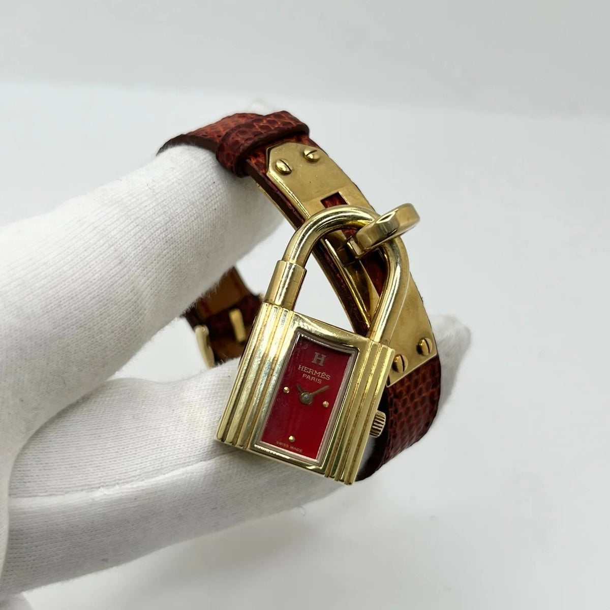 Montre HERMÈS Kelly plaqué or, acier et cuir