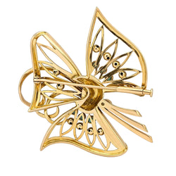 Broche en or jaune, émeraudes et diamants
