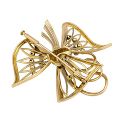 Broche en or jaune, émeraudes et diamants