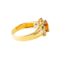 Bague Entourage en or jaune, saphir orange et diamants