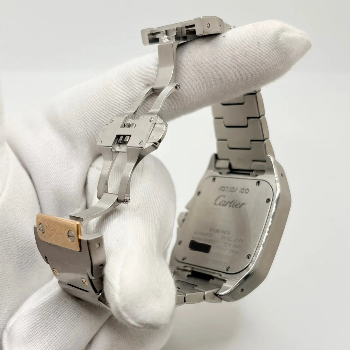 Montre CARTIER "Santos 100" en or jaune et acier inoxydable
