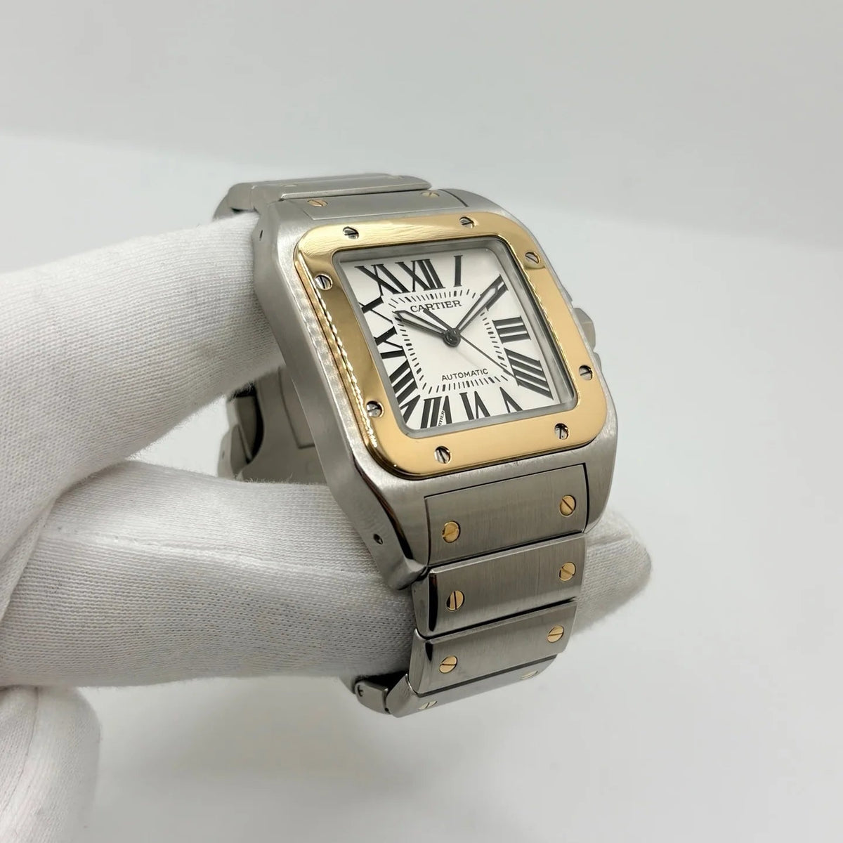 Montre CARTIER "Santos 100" en or jaune et acier inoxydable