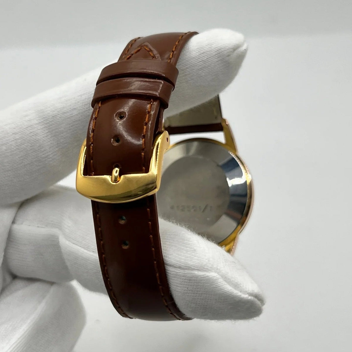 Montre UNIVERSAL GENÈVE plaqué or, acier et cuir