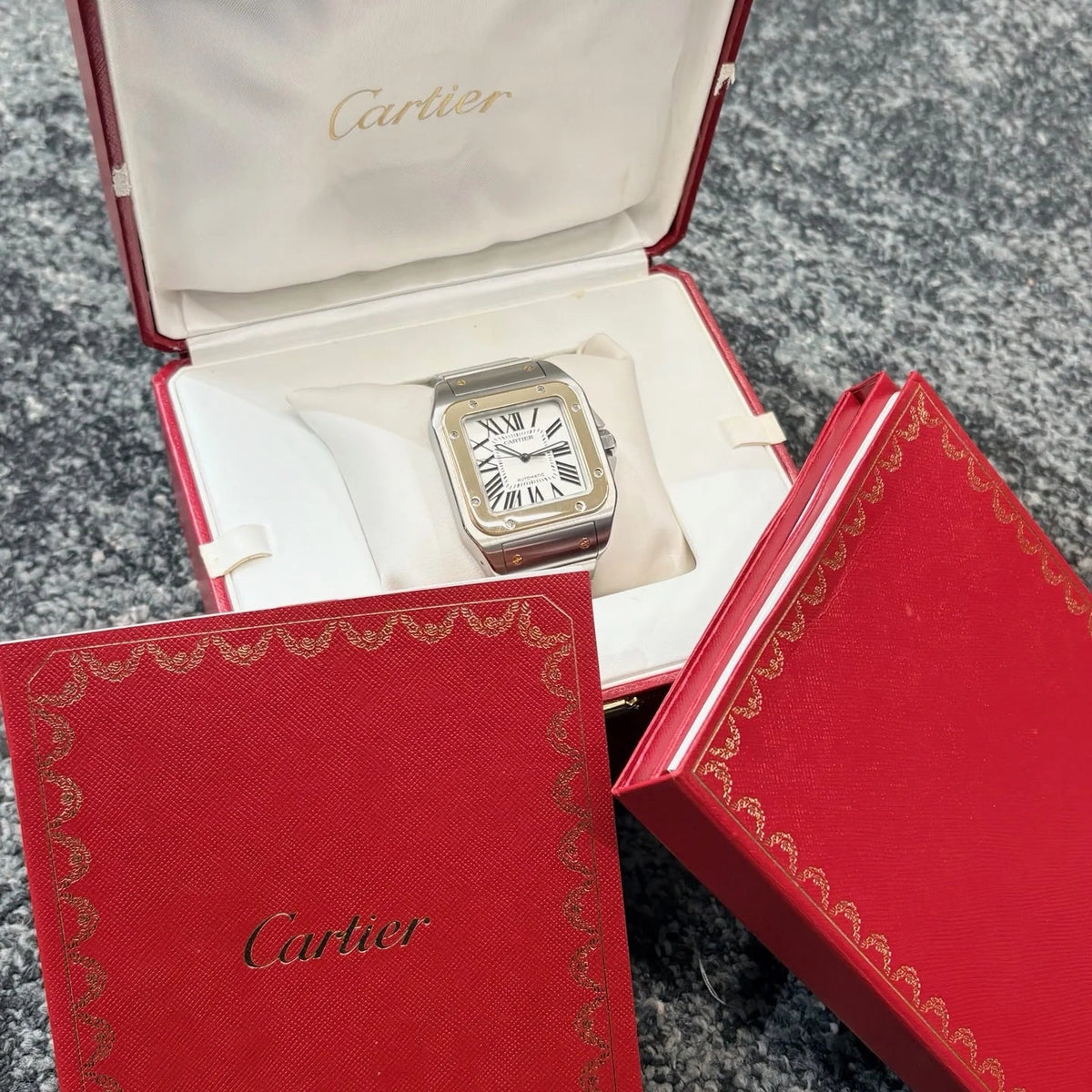 Montre CARTIER "Santos 100" en or jaune et acier inoxydable