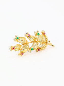 GUBELIN Broche feuille or rubis émeraudes - Castafiore