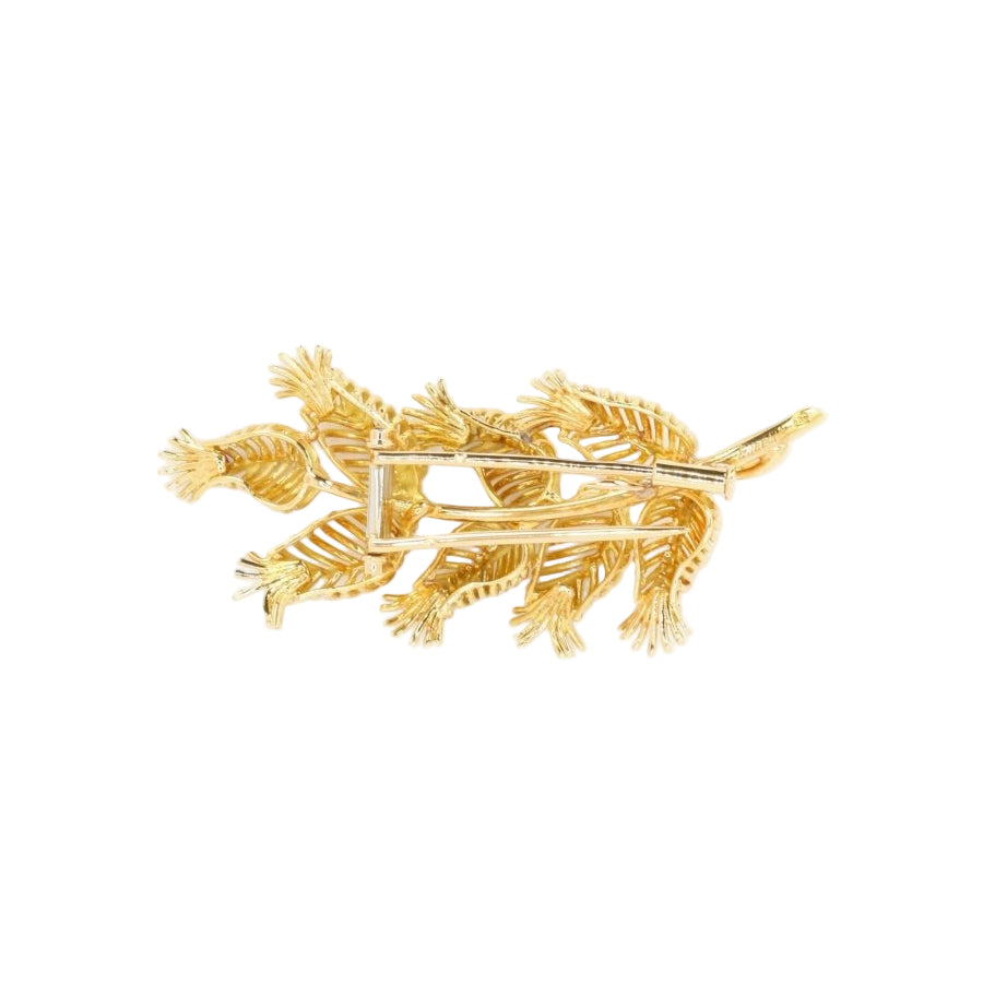 GUBELIN Broche feuille or rubis émeraudes - Castafiore