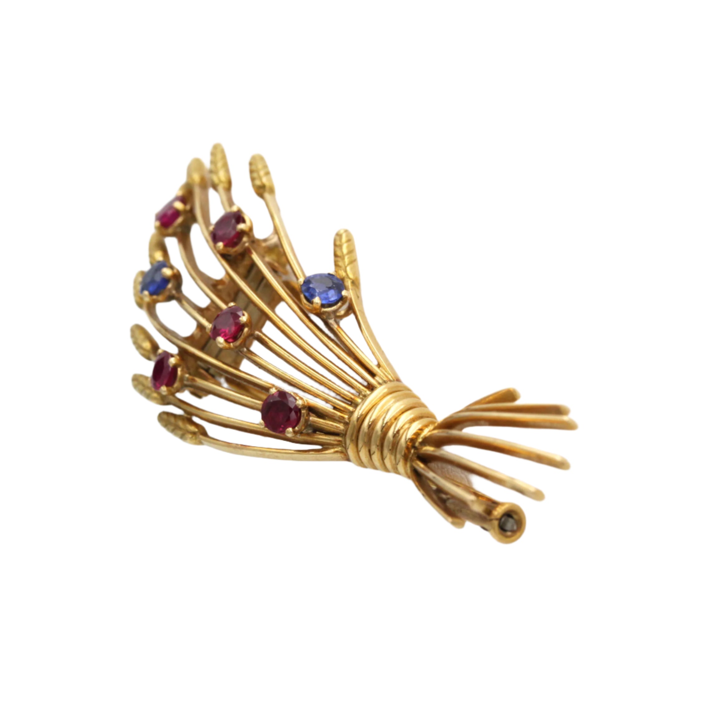 Broche Clip MELLERIO en or jaune, rubis et saphirs