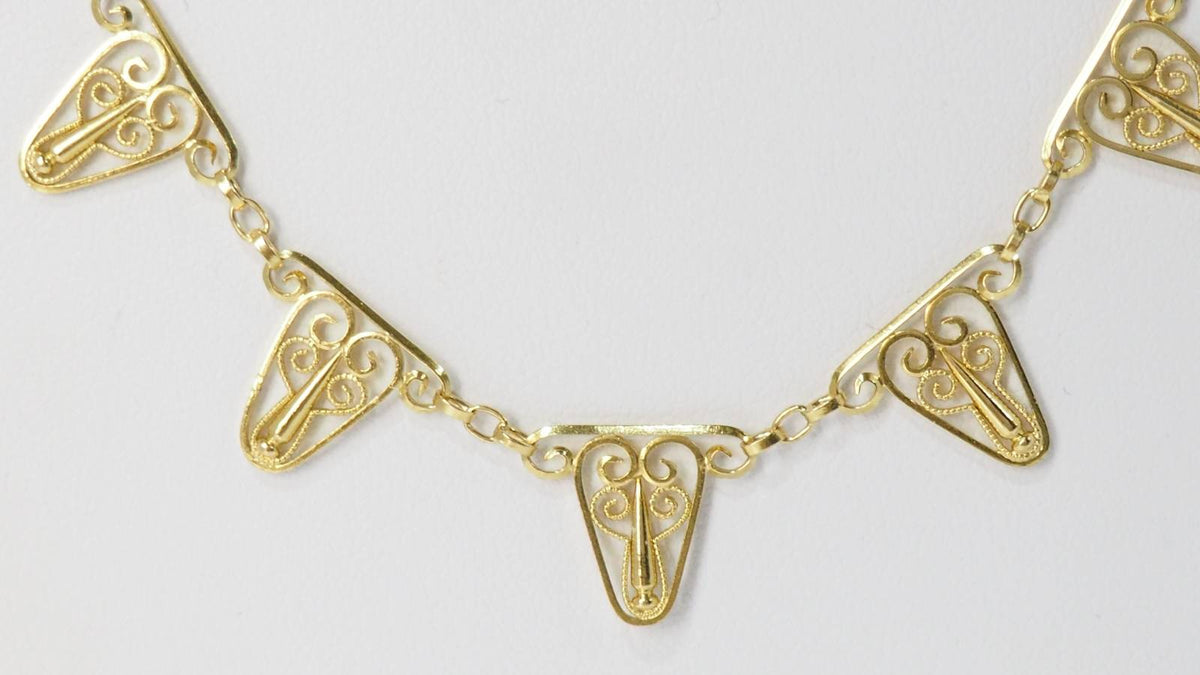 Collier draperie en or filigrané