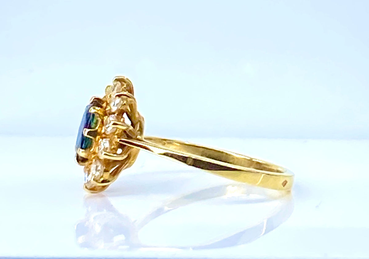 Bague marguerite en or jaune 18 carats, saphir et diamants