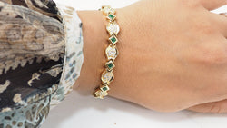 Bracelet en or jaune, émeraudes et diamants