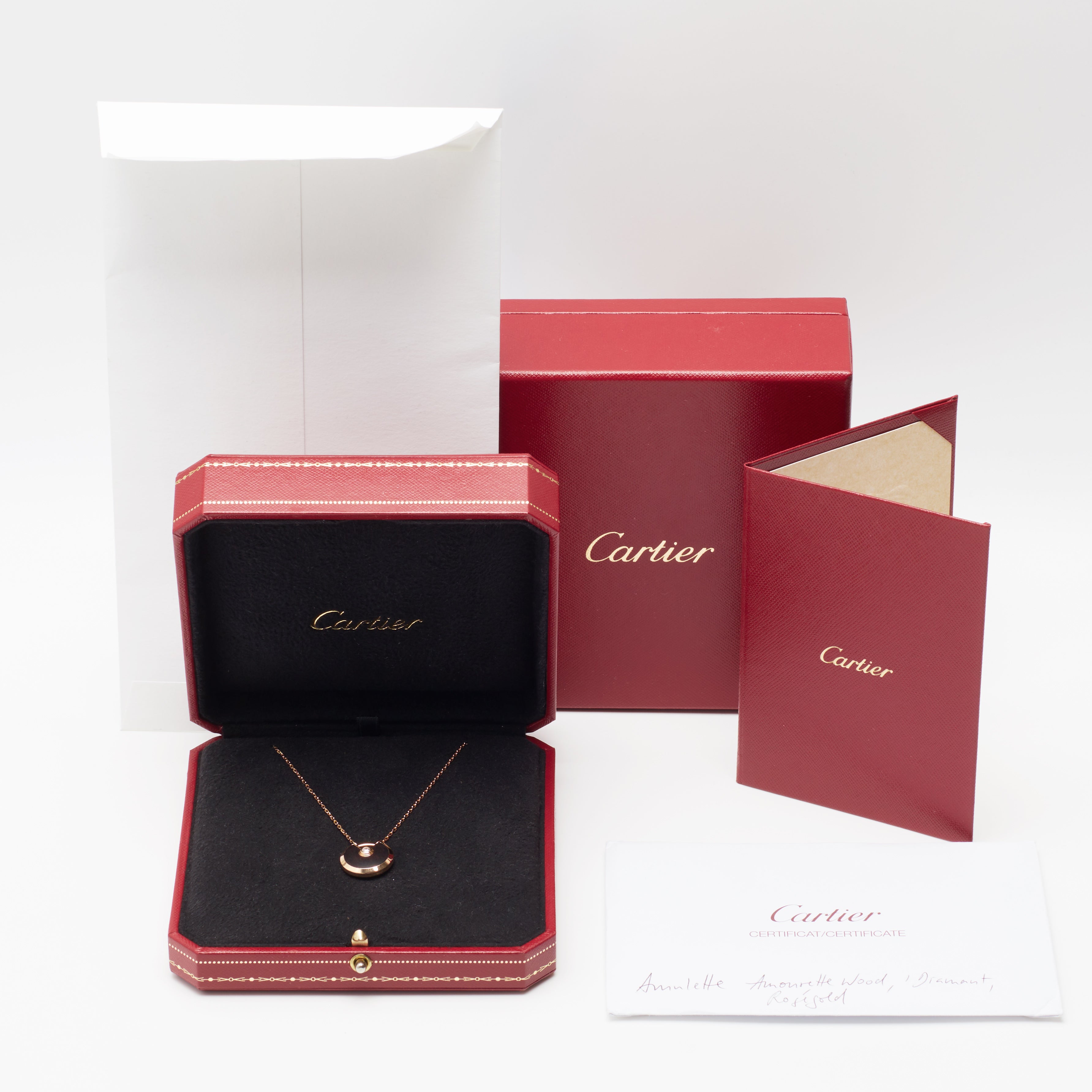 Sautoir Cartier Amulette PM en or rose et bois d'amourette