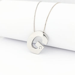Collier G en or blanc et diamant