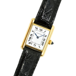 Montre CARTIER Tank Louis médium en or et saphir