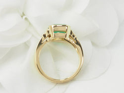 Ring in yellow gold, emerald and diamonds.