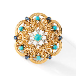 Brooch in yellow gold, turquoise, sapphires and diamonds