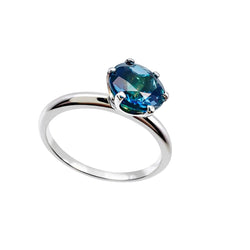 Bague solitaire en or blanc et topaze