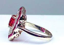 White gold ruby ​​and diamond daisy ring