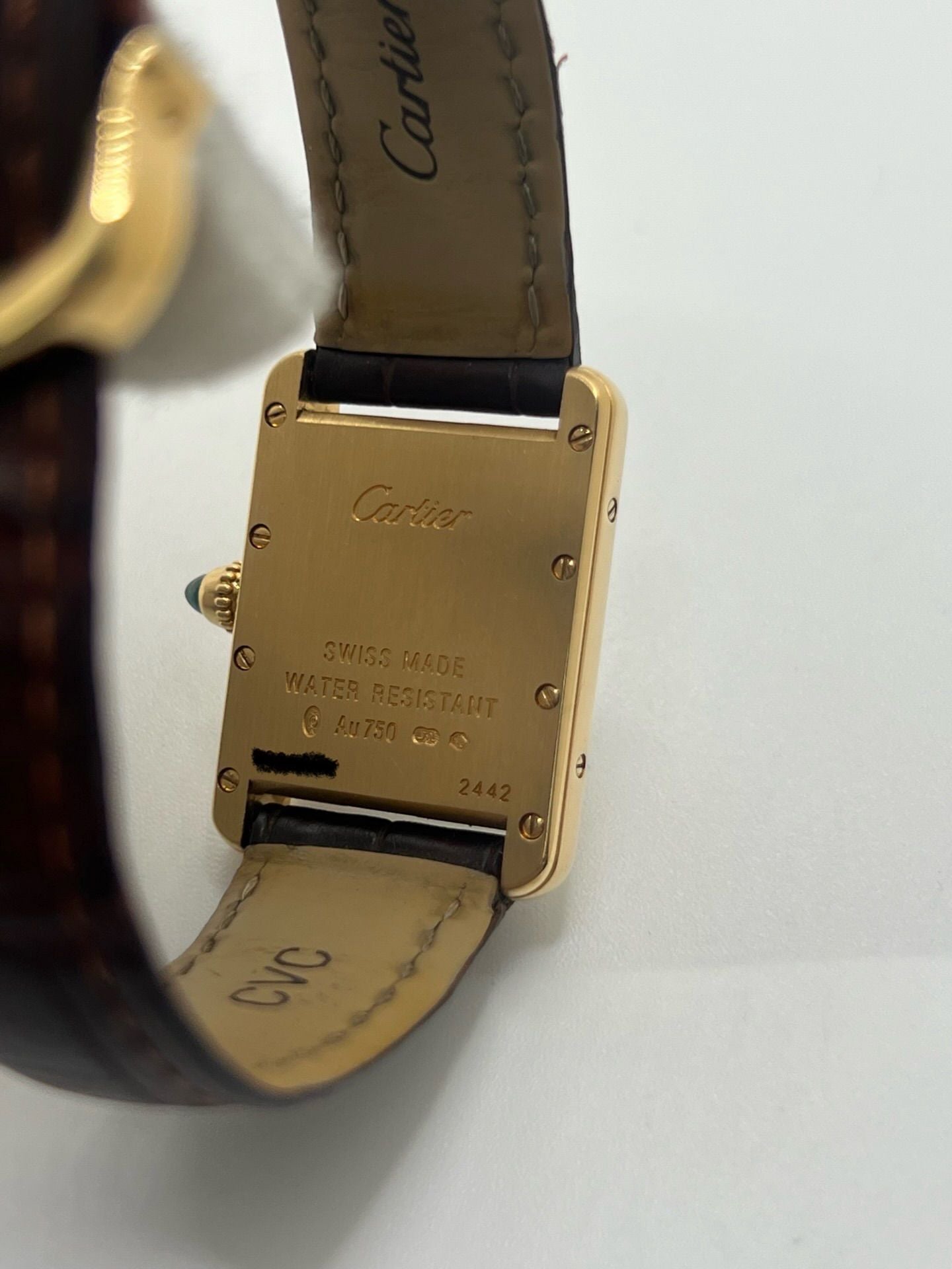 Montre CARTIER Tank Louis en or jaune, cuir et quartz